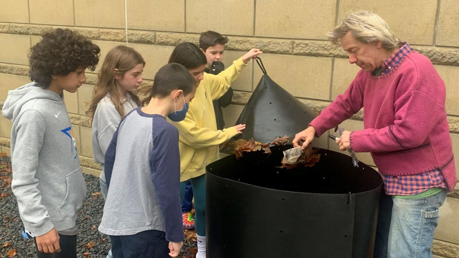 Students learning about composting