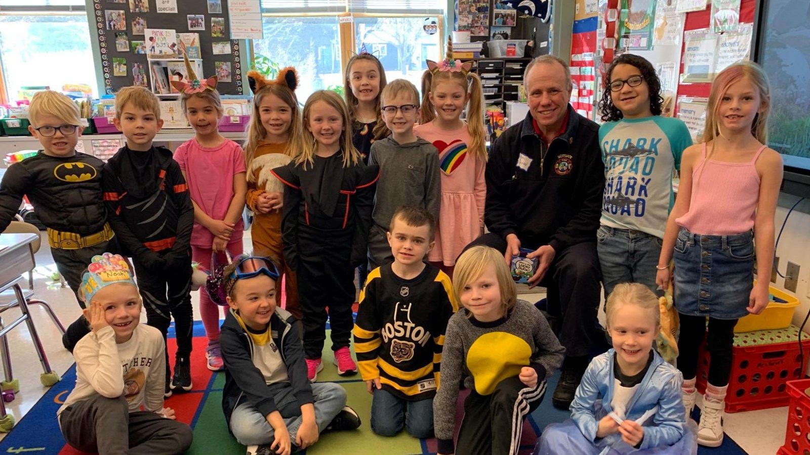 Deputy Fire Chief Donovan reads to students